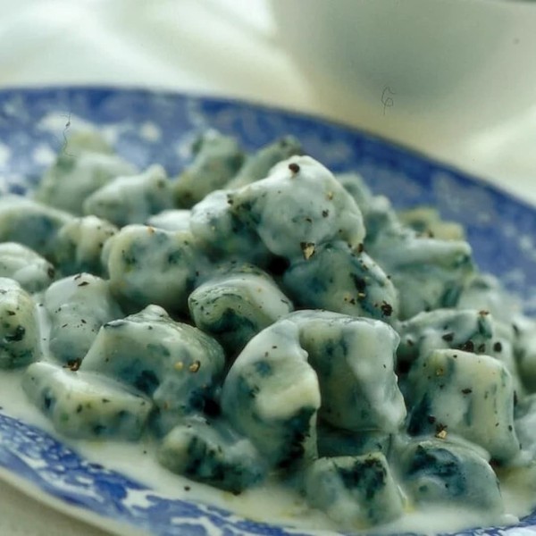 Mountain potato gnocchi with black kale and taleggio fondue